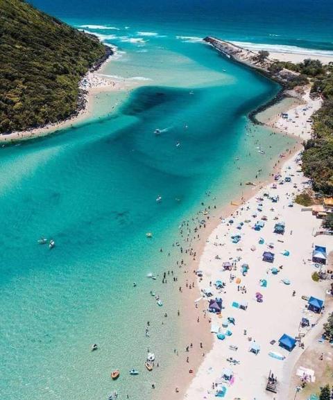 Aerial view of the clear turquoise water at the mouth of Tallebudgera Creek