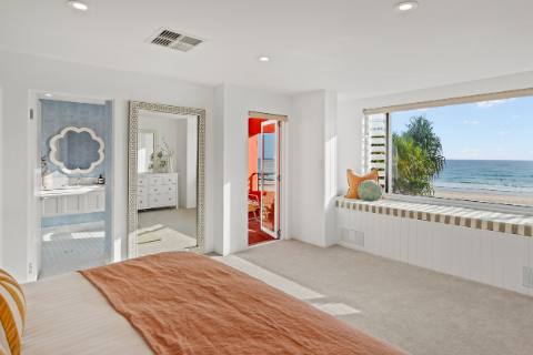 Master bedroom looking through to the ensuite and the beach beyond