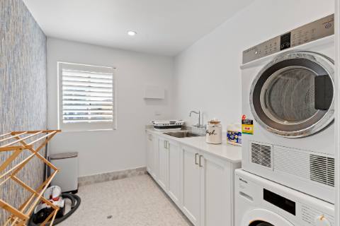 Full laundry with washer, dryer and a drying rack